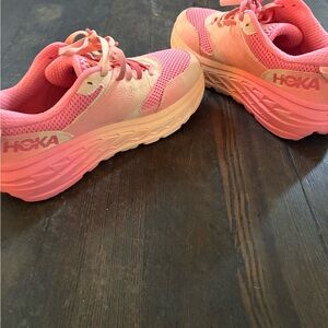 Hoka women’s sneakers in Pink and Orange sherbet